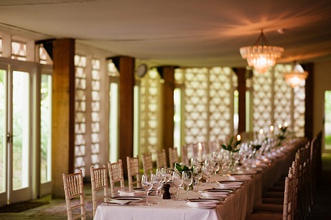 Table set for the wedding feast in the romantic garden wedding venue